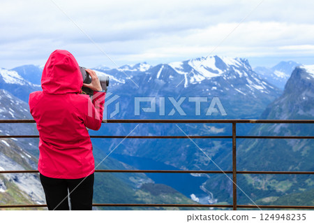 Tourist woman on Dalsnibba viewpoint Norway Tourist woman on Dalsnibba viewpoint Norway 124948235