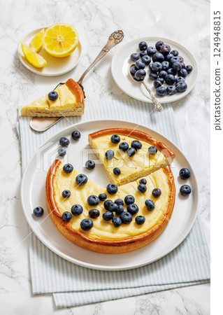 Cheesecake with blueberries sliced on a plate 124948815