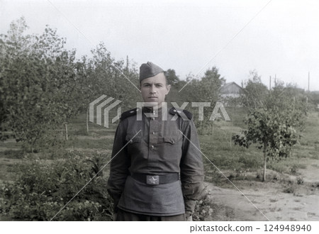 Vintage portrait of a Soviet soldier during training. Retro photo from 1952. 124948940