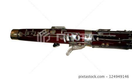 Close-up view of a bassoon showcasing its wooden craftsmanship and metal keys, ideal for musical education and instrument analysis, emphasizing its rich tones in performances. Close-up view of a bassoon showcasing its wooden craftsmanship and metal keys, ideal for musical education and instrument analysis, emphasizing its rich tones in performances. 124949146