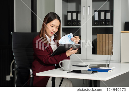 Project manager working and update tasks with milestones progress planning and photo professional investor working new start up project in the Office. Project manager working and update tasks with milestones progress planning and photo professional investor working new start up project in the Office. 124949673