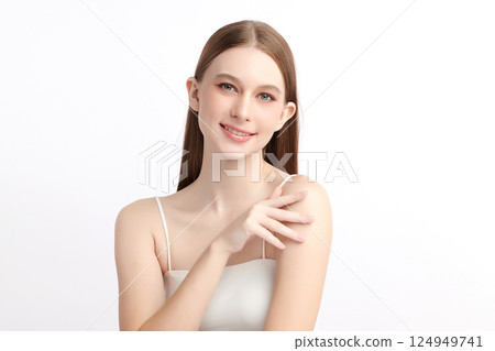 A beautiful young Asian woman with clean, fresh skin against a white background. Skincare, facial treatment, cosmetology, beauty, and spa. An elegant portrait of an Asian woman. 124949741