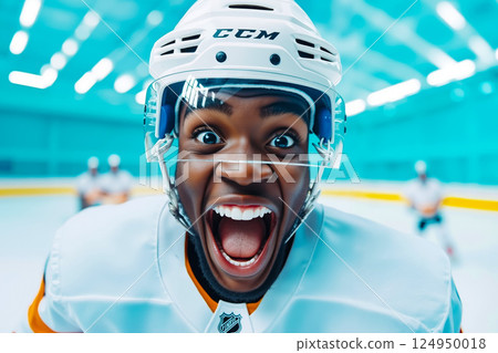 A hockey player with his mouth open and tongue out A hockey player with his mouth open and tongue out 124950018