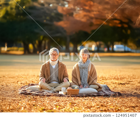 Image of a senior couple meditating in the park Image of a senior couple meditating in the park 124951407