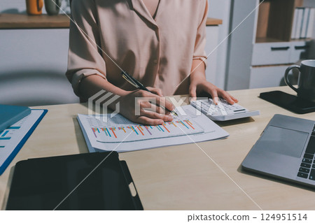 Tax deduction planning concept. Women use a calculator to calculate expenses and taxes to receive tax deductions for personal individual Income. tax return for individual persons.monthly expenses 124951514