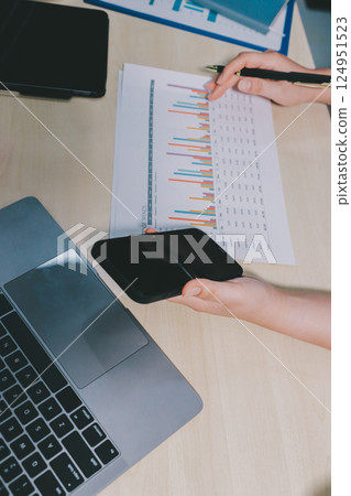 Tax deduction planning concept. Women use a calculator to calculate expenses and taxes to receive tax deductions for personal individual Income. tax return for individual persons.monthly expenses 124951523