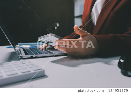 Tax deduction planning concept. Women use a calculator to calculate expenses and taxes to receive tax deductions for personal individual Income. tax return for individual persons.monthly expenses 124951579