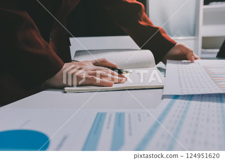 Tax deduction planning concept. Women use a calculator to calculate expenses and taxes to receive tax deductions for personal individual Income. tax return for individual persons.monthly expenses 124951620