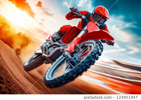 A person riding a dirt bike on a dirt road 124951947