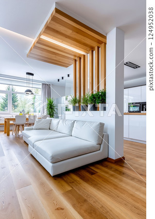A living room with a white couch and wooden beams 124952038