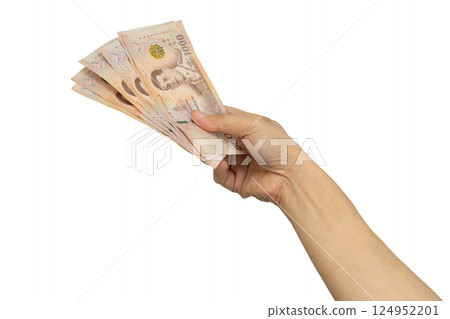 Asian woman holding Thai baht banknote money in hand isolated on white background. 124952201