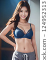 Woman in grey shorts and blue bra 124952313