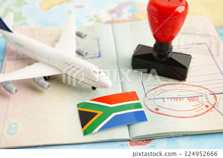 South Africa flag and passport with airplane for travel. South Africa flag and passport with airplane for travel. 124952666