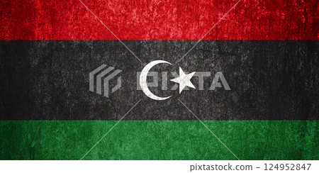 Libya State Flag. Dirty Libya flag on metal surface. 124952847