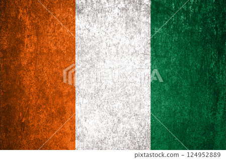 Cote d'Ivoire State Flag. Dirty Cote d'Ivoire flag on metal surface. 124952889