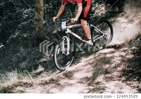 Mountain Bike cyclist riding track at sunny day, healthy lifestyle active athlete doing sport 124953585