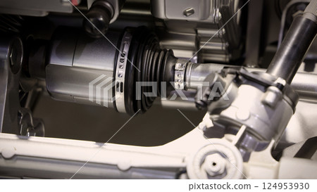 Car suspensions. Close up of a car suspension parts system such as CV joint Rubber boot and Control arms bushing Steering rack axles Shock absorber suspension Brake. Repair and spare parts for cars. Car suspensions. Close up of a car suspension parts system such as CV joint Rubber boot and Control arms bushing Steering rack axles Shock absorber suspension Brake. Repair and spare parts for cars. 124953930