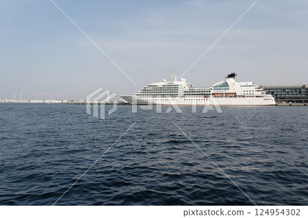 The passenger ship Seabourn Quest and Yokohama Bay Bridge moored at Shinko Pier, seen from Yokohama Minato Mirai Waterfront Park 124954302