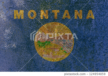 Montana State Flag. Dirty Montana state flag on rusty metal surface. 124954859