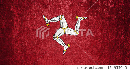 Isle of Mann Flag. Dirty Isle of Mann flag on metal surface. Isle of Mann Flag. Dirty Isle of Mann flag on metal surface. 124955043