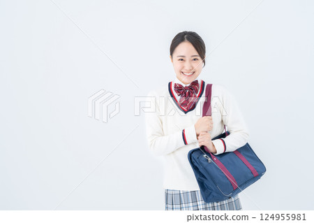 High school girl with school bag 124955981