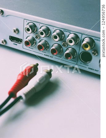 Left and right channel plugs disconnected from output video slots at multimedia player rear panel rare style photo Left and right channel plugs disconnected from output video slots at multimedia player rear panel rare style photo 124956736