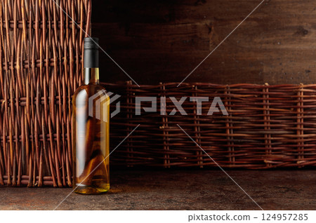 Bottle of white wine on a vintage background. Bottle of white wine on a vintage background. 124957285