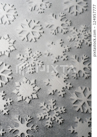 White snowflakes on a gray background. 124957777