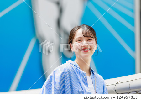 A young woman taking a selfie while sightseeing in Osaka 124957815