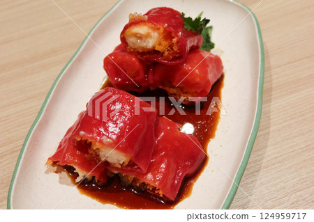 close up of Chinese traditional dim sum of Minced shrimp and assorted vegetables rice rolls wrapped spring rolls close up of Chinese traditional dim sum of Minced shrimp and assorted vegetables rice rolls wrapped spring rolls 124959717