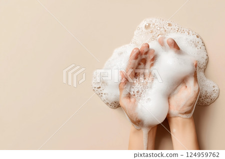 Hands holding soapy bubbles, emphasizing cleanliness and hygiene. 124959762