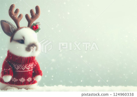 Rabbit in a red sweater with horns against the background of snow. Space for text. Rabbit in a red sweater with horns against the background of snow. Space for text. 124960338