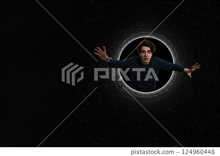 A man falls into a dark funnel on a black background. Space for text. A man falls into a dark funnel on a black background. Space for text. 124960448