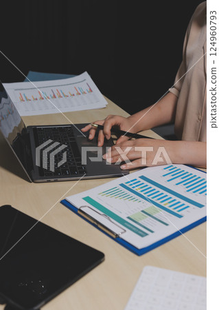 Tax deduction planning concept. Women use a calculator to calculate expenses and taxes to receive tax deductions for personal individual Income. tax return for individual persons.monthly expenses 124960793