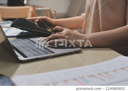 Tax deduction planning concept. Women use a calculator to calculate expenses and taxes to receive tax deductions for personal individual Income. tax return for individual persons.monthly expenses Tax deduction planning concept. Women use a calculator to calculate expenses and taxes to receive tax deductions for personal individual Income. tax return for individual persons.monthly expenses 124960802