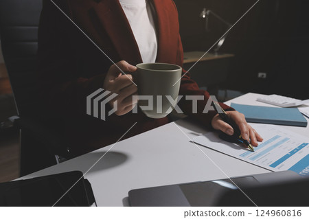 Tax deduction planning concept. Women use a calculator to calculate expenses and taxes to receive tax deductions for personal individual Income. tax return for individual persons.monthly expenses 124960816