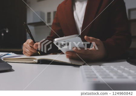 Tax deduction planning concept. Women use a calculator to calculate expenses and taxes to receive tax deductions for personal individual Income. tax return for individual persons.monthly expenses 124960842
