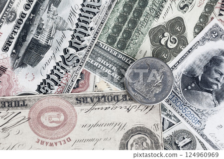 Greenback US paper dollars and silver certificates with silver dollar coins Greenback US paper dollars and silver certificates with silver dollar coins 124960969