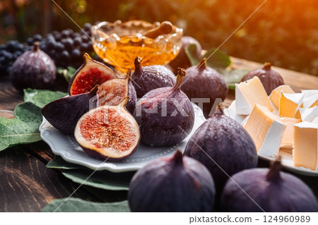 Cheese Platter With Camembert Brie, Healthy Juicy Organic Figs, Honey And Grapes Cheese Platter With Camembert Brie, Healthy Juicy Organic Figs, Honey And Grapes 124960989