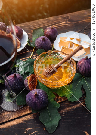 Cheese Platter With Camembert Brie, Healthy Juicy Organic Figs, Honey And Grapes Cheese Platter With Camembert Brie, Healthy Juicy Organic Figs, Honey And Grapes 124961069