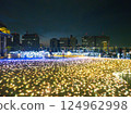 Illuminations of light blooming on the ground 124962998