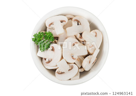 Fresh mushroom champignon slices in a ceramic bowl isolated on white background. Top view. Flat lay 124963141