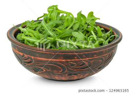 Heap of green fresh rucola or arugula leaf in ceramic bowl isolated on white background Heap of green fresh rucola or arugula leaf in ceramic bowl isolated on white background 124963165