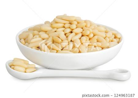 Shelled European pine nuts in ceramic bowl isolated on white background with full depth of field 124963187