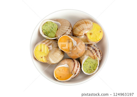 escargot snail filled with different fillings in ceramic bowl isolated on white background. Top view. Flat lay 124963197