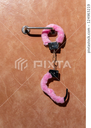 Pink fluffy handcuffs Pink fluffy handcuffs 124963219