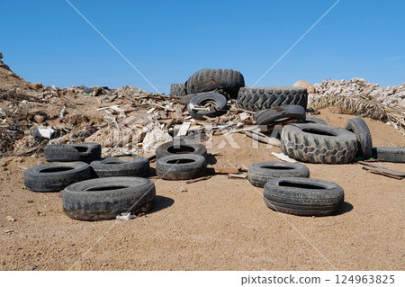 Tyres lies on the dump, abuse of environment Tyres lies on the dump, abuse of environment 124963825