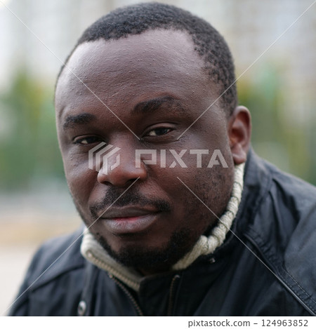 African american man from Nigeria looks at camera African american man from Nigeria looks at camera 124963852