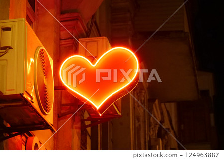 Red passionate heart on a night street 124963887