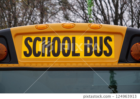 The inscription School Bus on a yellow bus The inscription School Bus on a yellow bus 124963913